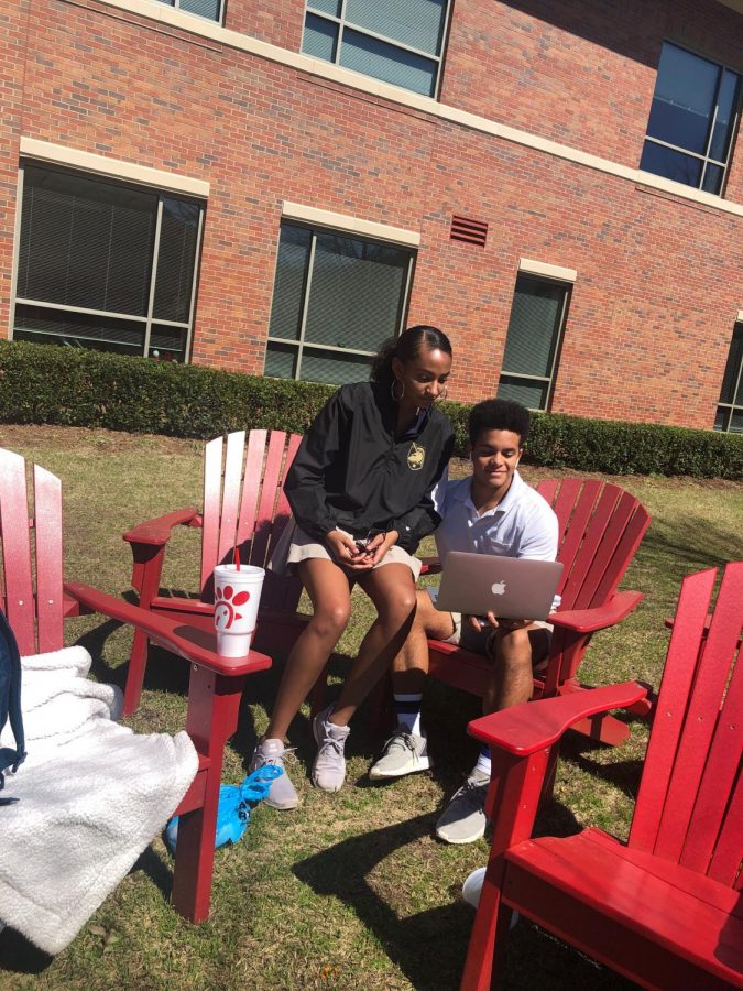 Mikenzie and Navaar enjoy the warmer weather during an outside study session. 