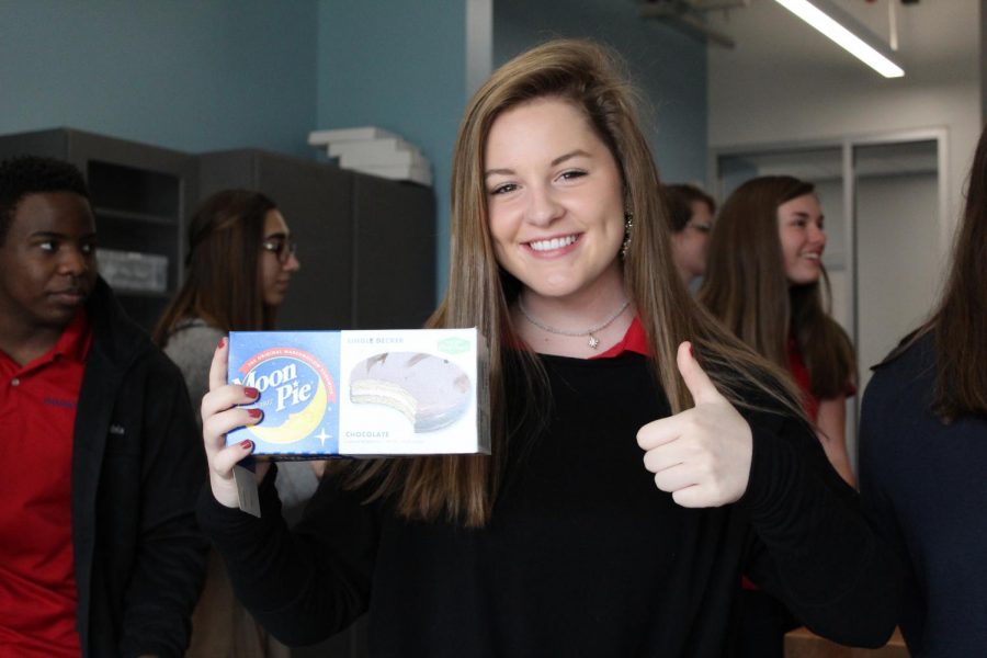 Lyndsay Moore poses with some Moon Pies during Mr. Boeschens class.