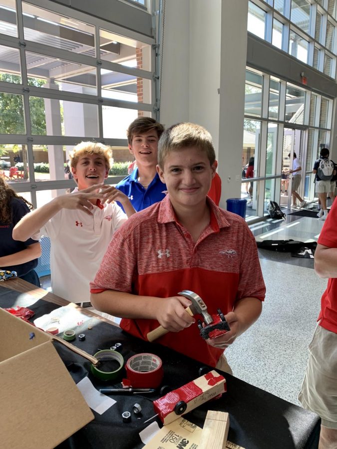 Frank Robinson, Henry Mashburn & Grant Dorsey build cars to race down the ramp.